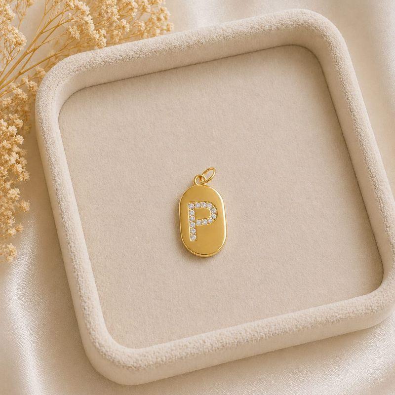 Pingente Letra Oval Cravejada P (19x10mm)